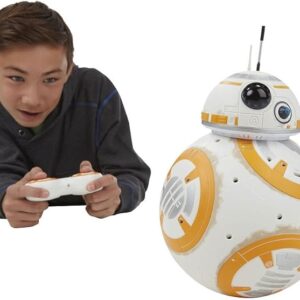 Boy with a handset driving the intelligent RC robot droid ball, a white and orange remote control toy