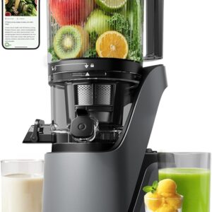 Canoly C16 cold press juicer with its wide feed chute full of fruit, beside glasses of fresh juice