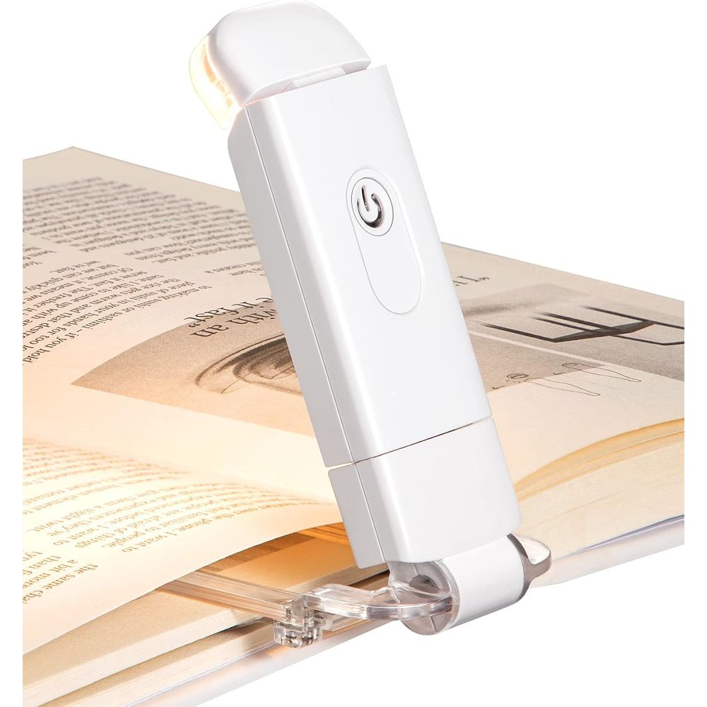 DEWENWILS rechargeable clip-on book light with amber LED clipped to an open book