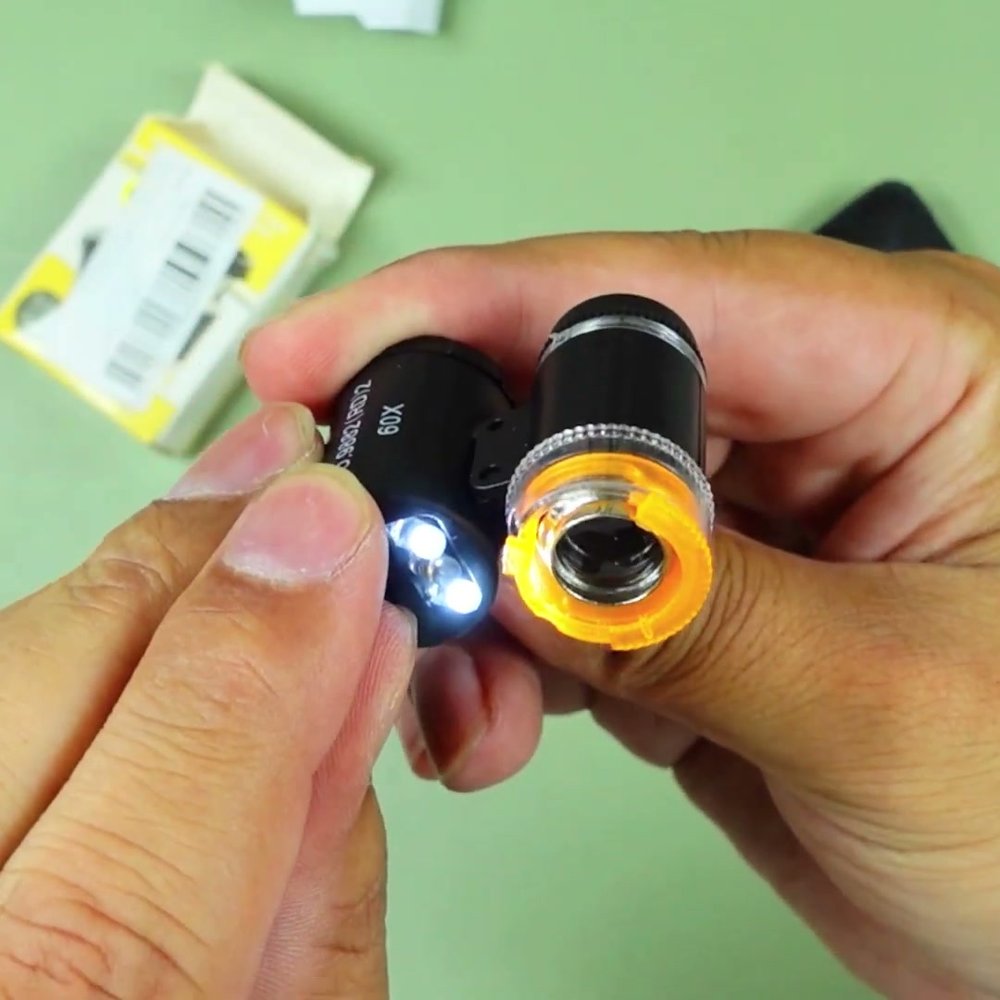 Real photo of the pocket microscope lit up in the Gadget Hunting with RR review
