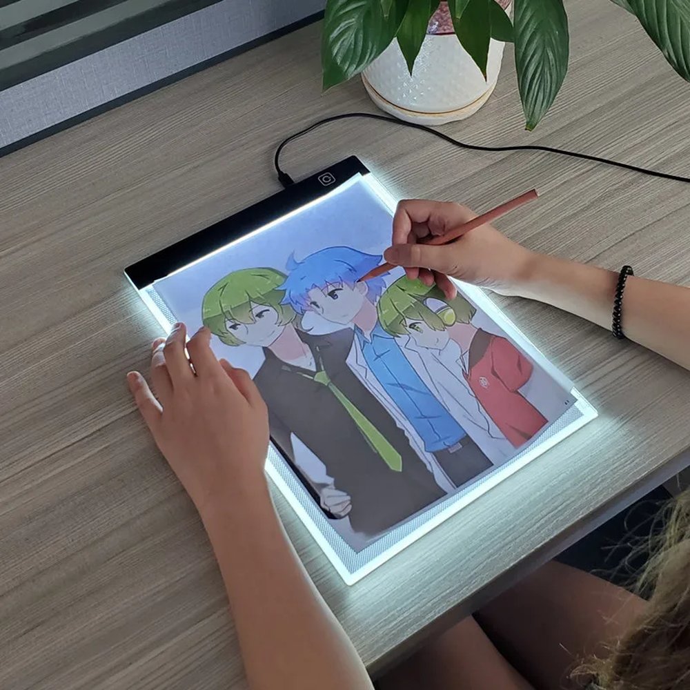 Kids tracing a drawing on the A4 LED light pad