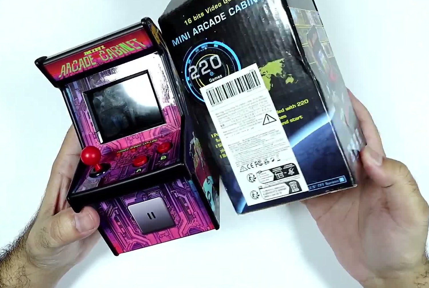 The mini arcade console beside its retail box, which is marked Mini Arcade Cabinet with 220 games