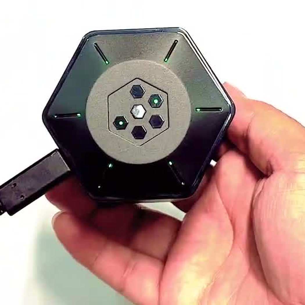 The underside of the charging case with a USB-C cable plugged in and running to a power bank