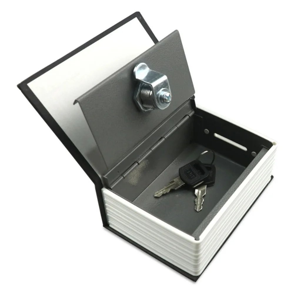 Dictionary book safe opened to show the metal lock box and keys
