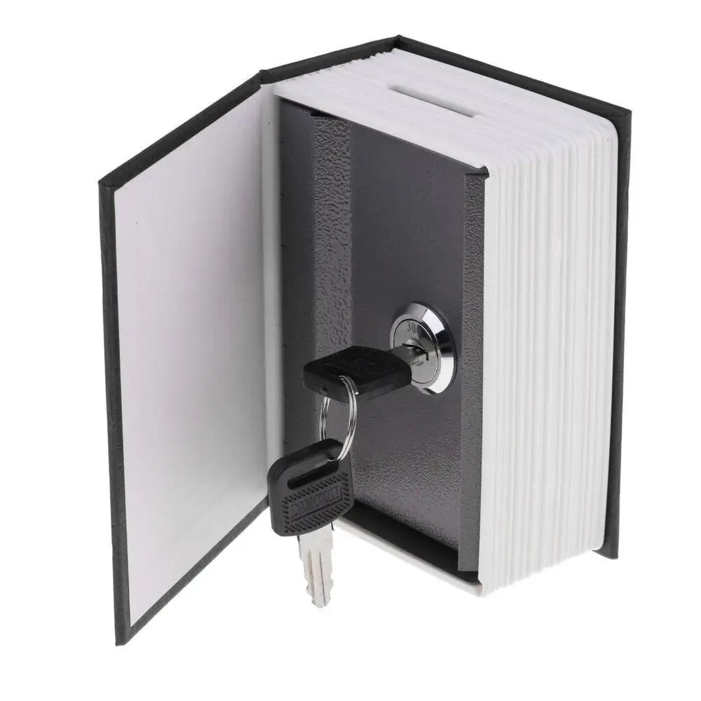 Dictionary book safe standing open with key in the lock