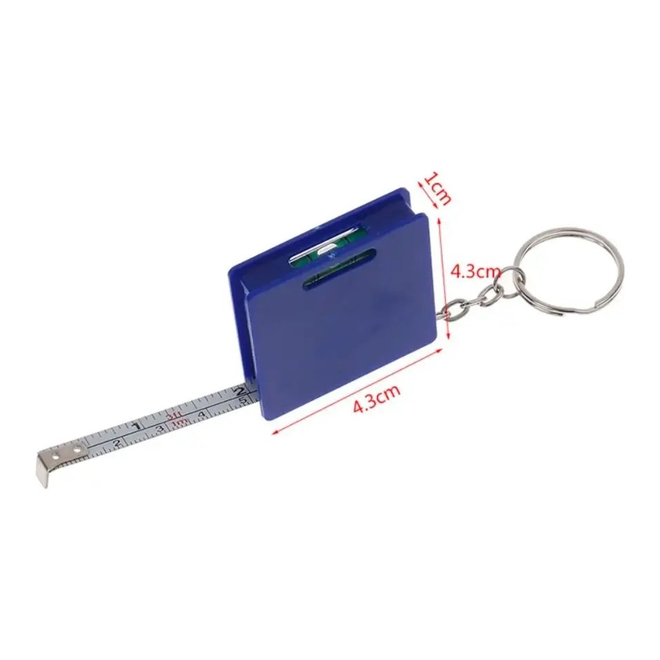 Blue square mini tape measure keychain with its steel tape partly extended and a split key ring attached, on white