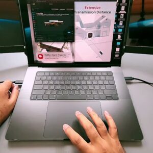 The GTMEDIA Mate X mounted on a laptop with both 11.6-inch side screens extended and lit