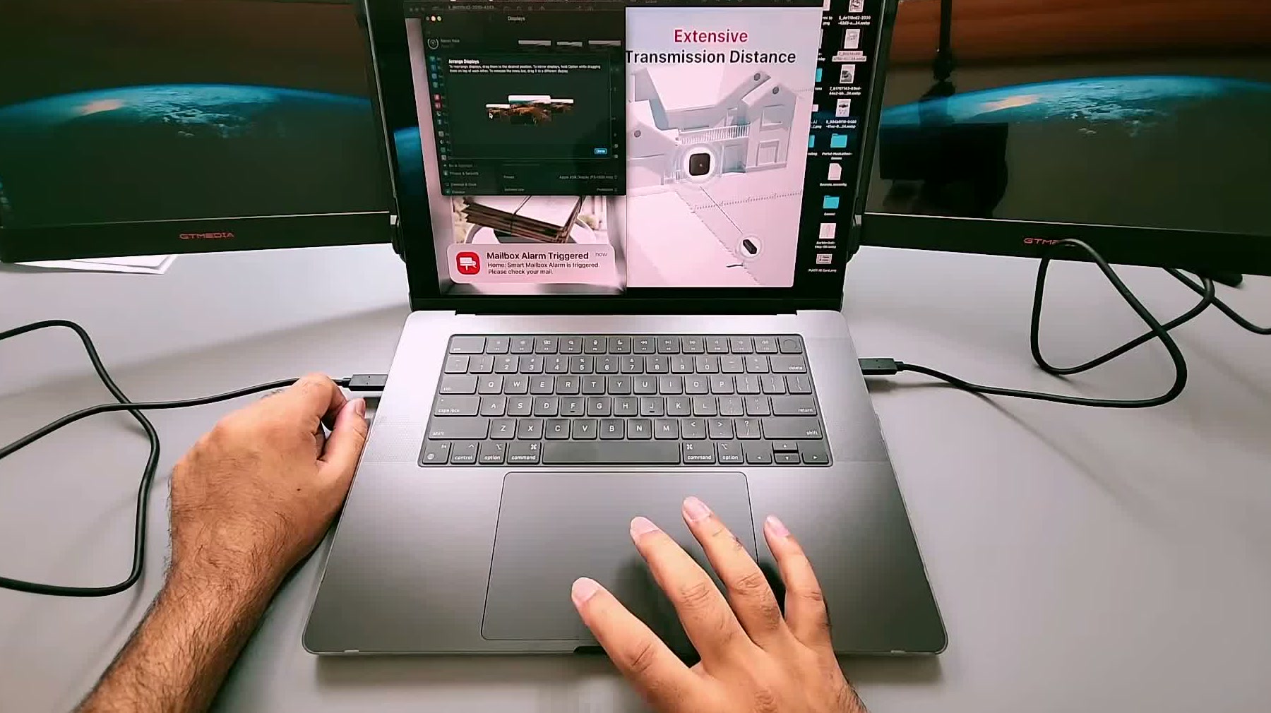 The GTMEDIA Mate X mounted on a laptop with both 11.6-inch side screens extended and lit