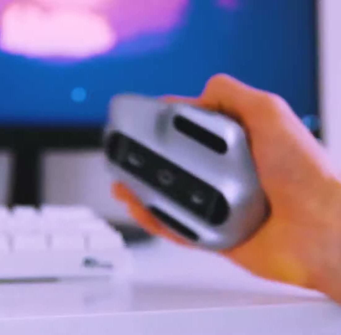 Underside of the Logitech MX Master 3 held up, showing the Darkfield sensor, power switch and Easy-Switch button
