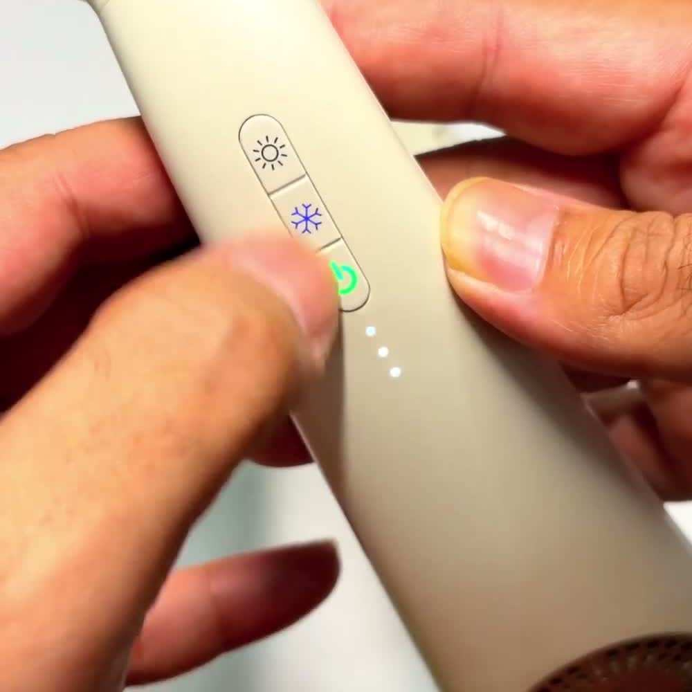 Close-up of the COOLiFY Air 2025 control button with its heating, cooling and power icons
