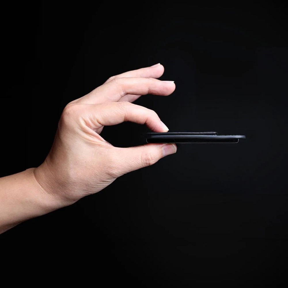 PUNCUBE Minimal Wallet 3.0 slim profile held in hand