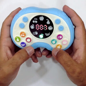 Blue kids speed push game machine held straight on in both hands, LED score display reading 000 and ten coloured fruit buttons around it